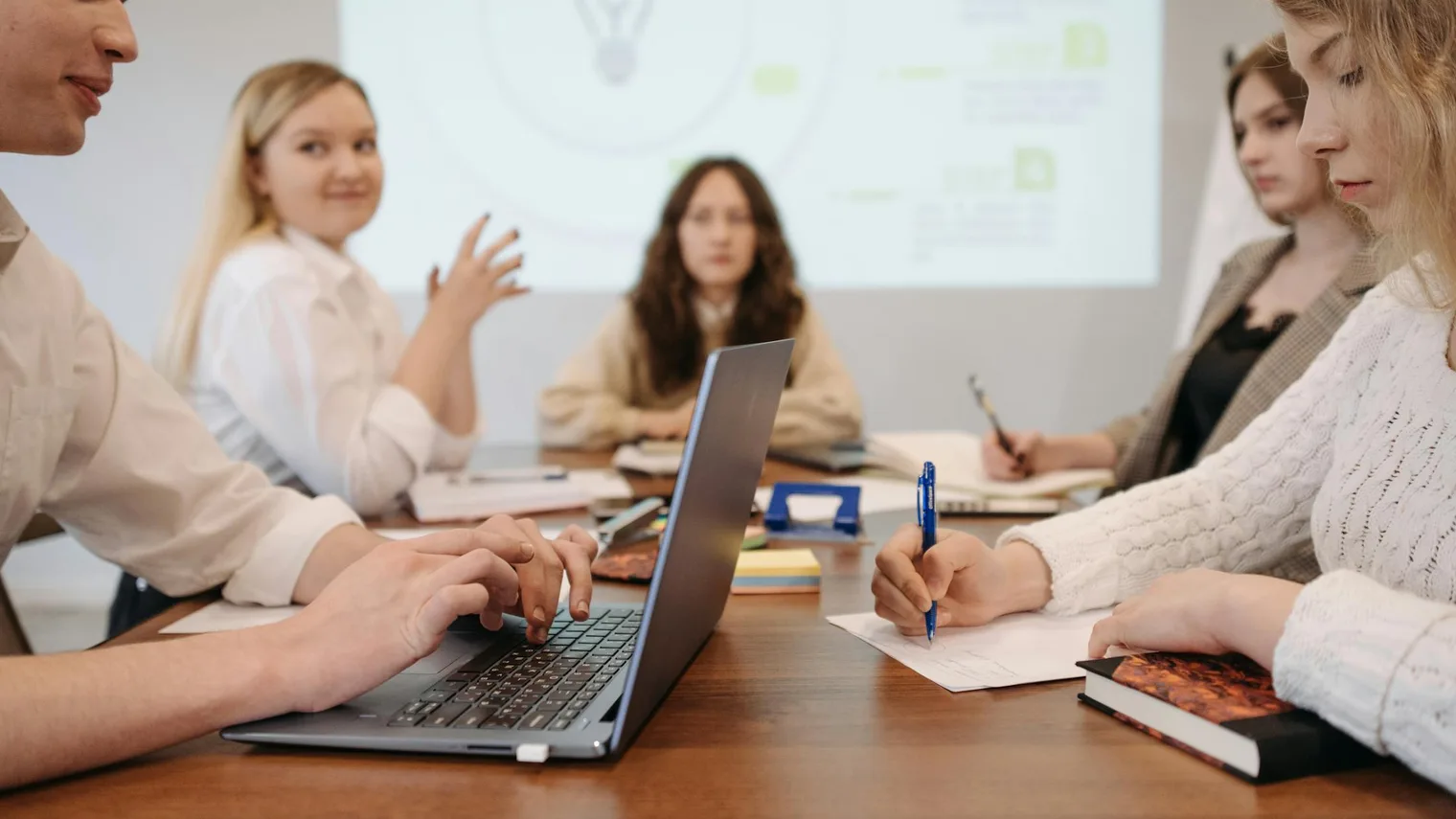 Candidates reviewing notes in a group practice setting after turning accomplishment entries into interview answers