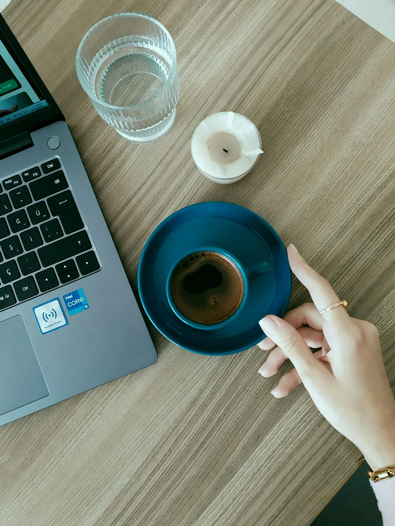 Coffee break beside a laptop after stopping behavioral interview practice before over-rehearsing