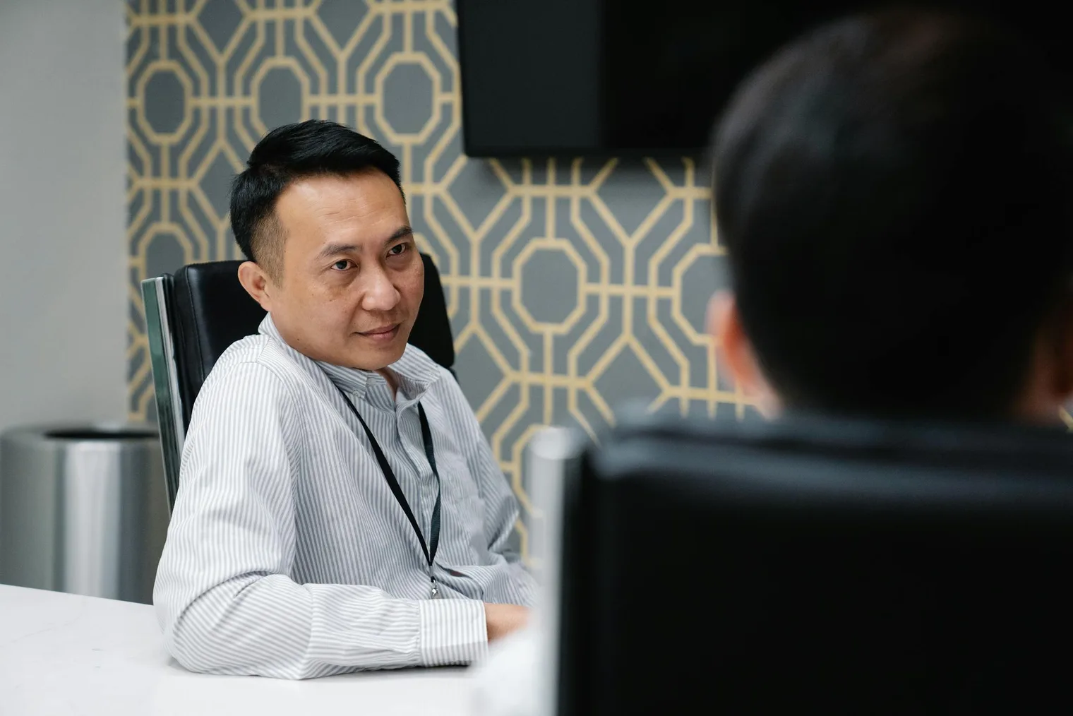 Executive interview discussion where a candidate explains personal traits and role fit