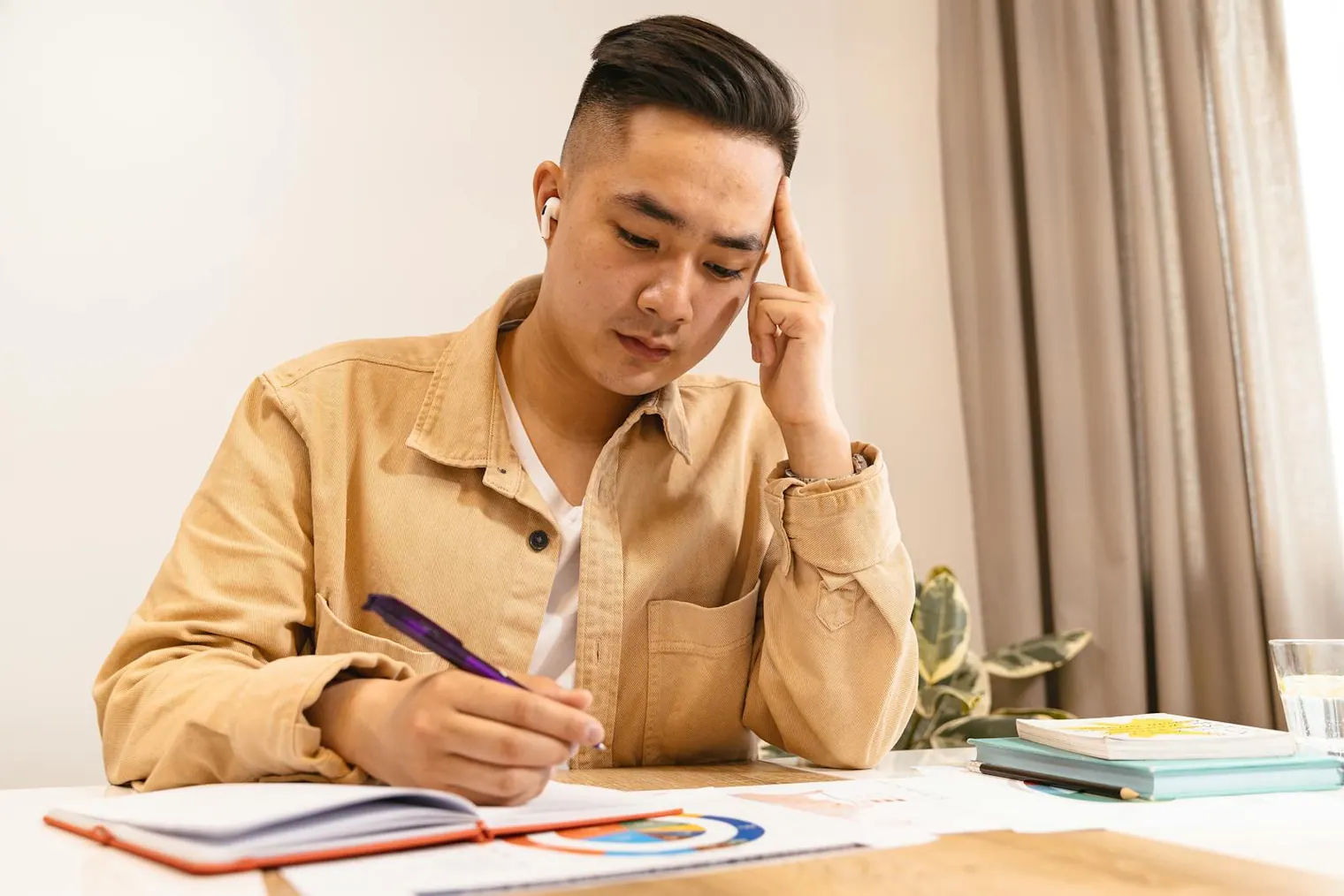 Candidate reviewing notes after transcript practice without becoming overly self-critical