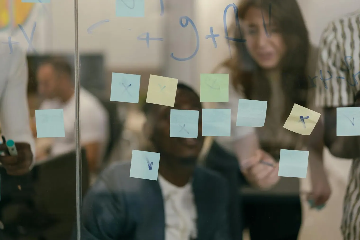 Privacy-conscious interview transcript notes organized on a glass board for repeated answer patterns