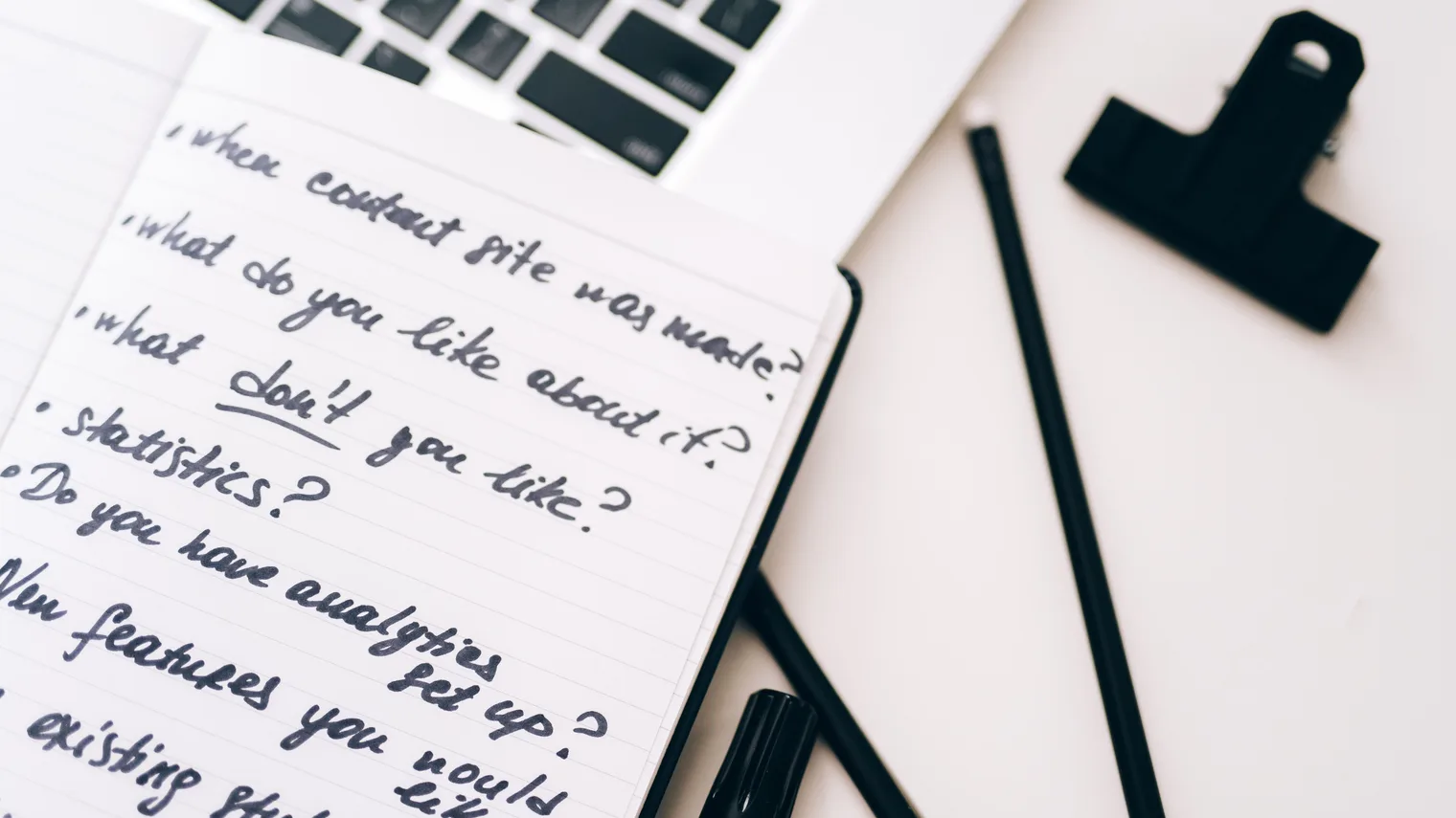 Notebook and laptop notes for HireVue interview prep answer cues