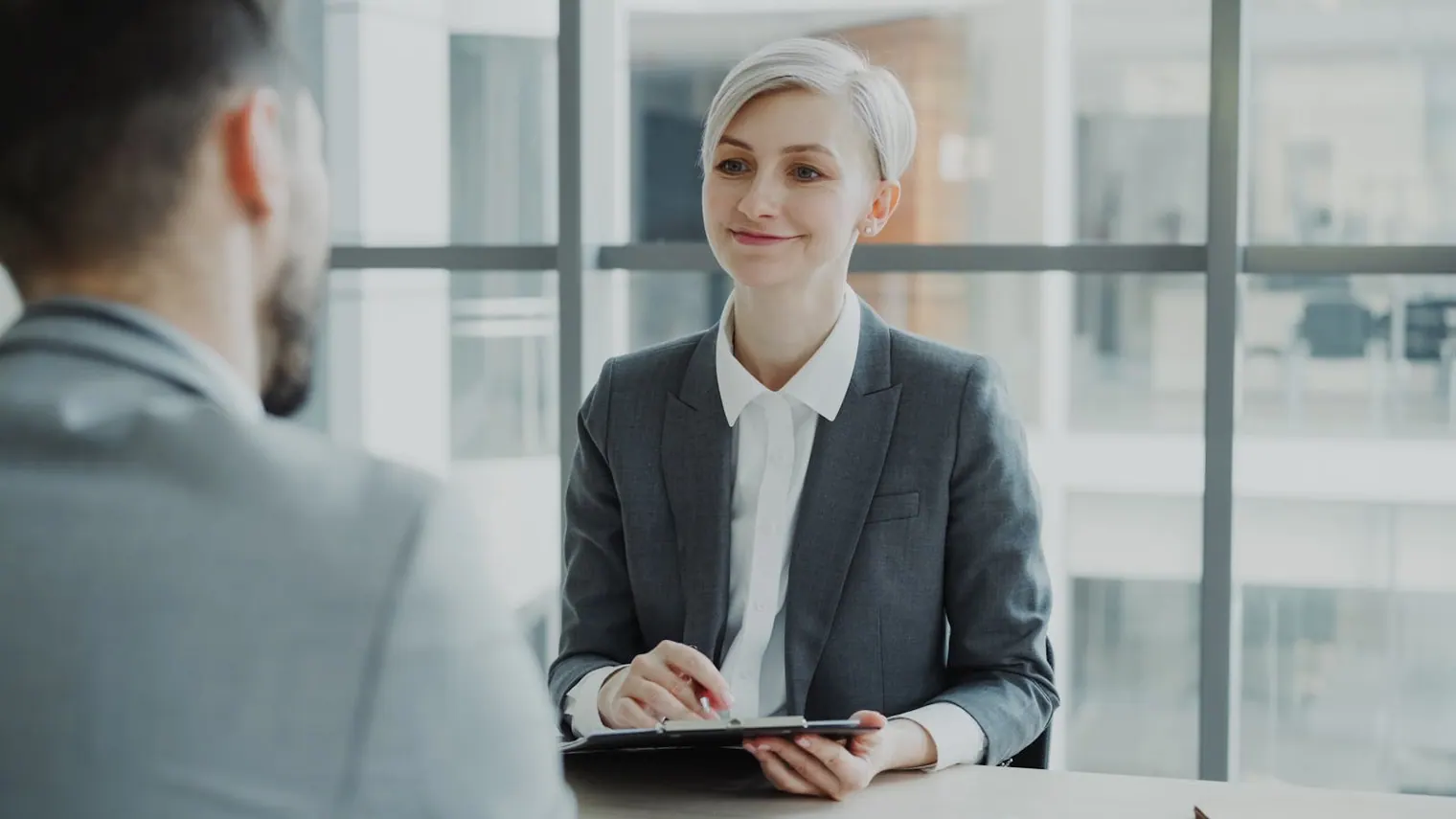 Candidate and interviewer reviewing notes after a practice interview round