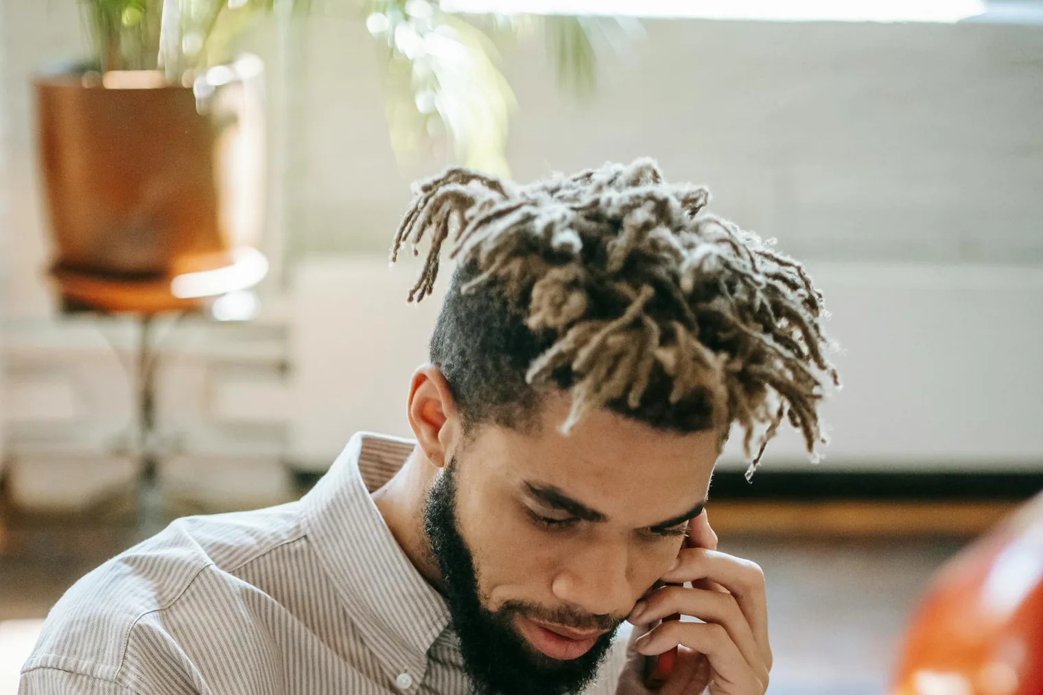 Candidate using a notebook to prepare short phone interview answers