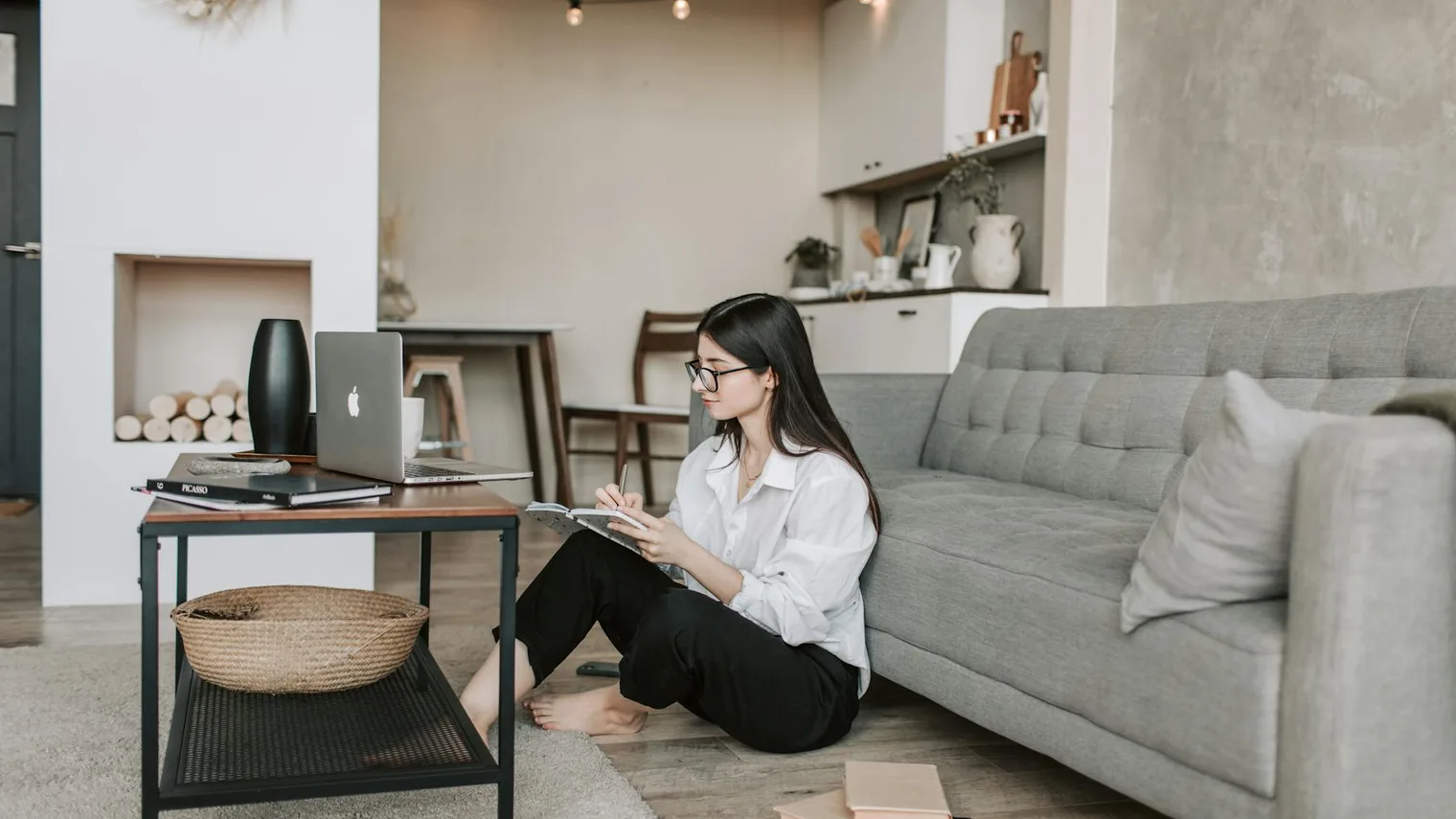 Candidate checking a laptop while planning a post-interview follow-up email