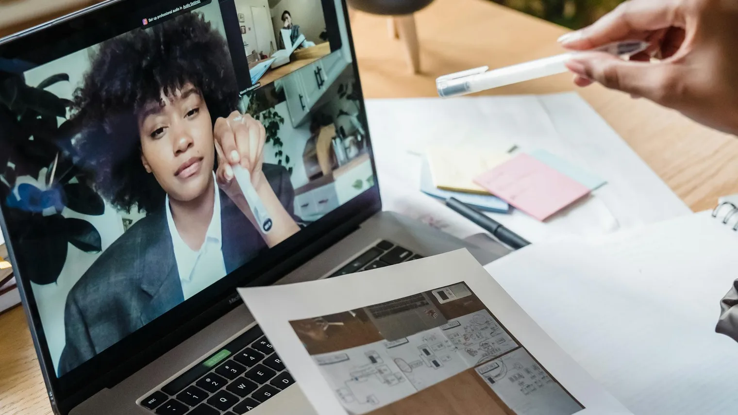 Candidate reviewing documents and a video call after virtual interview practice