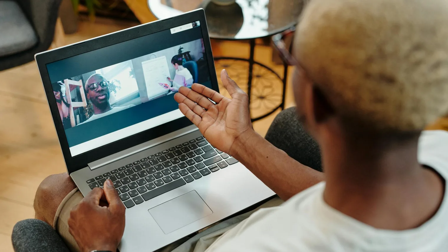 Candidate speaking during a virtual interview video call on a laptop