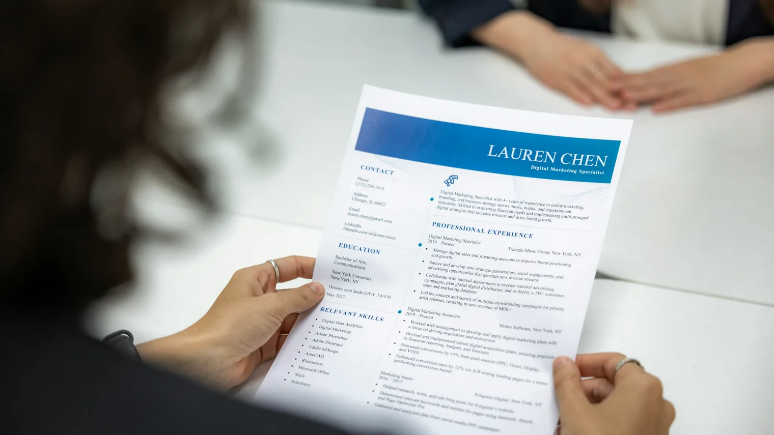 Resume being reviewed during interview preparation while mapping job signals to answer proof points