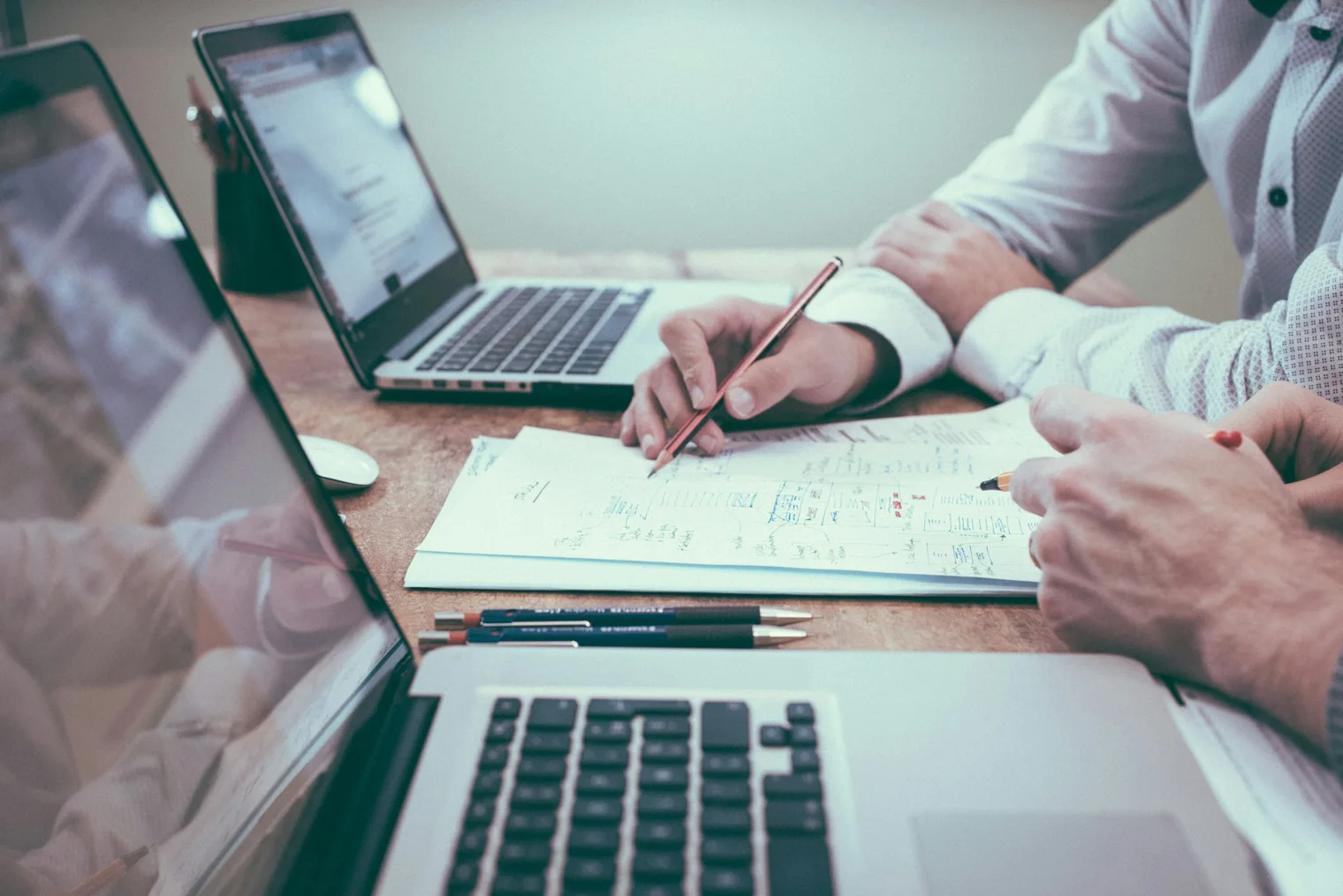 Laptop and planning notes used to prepare technical SEO and content strategy interview answers